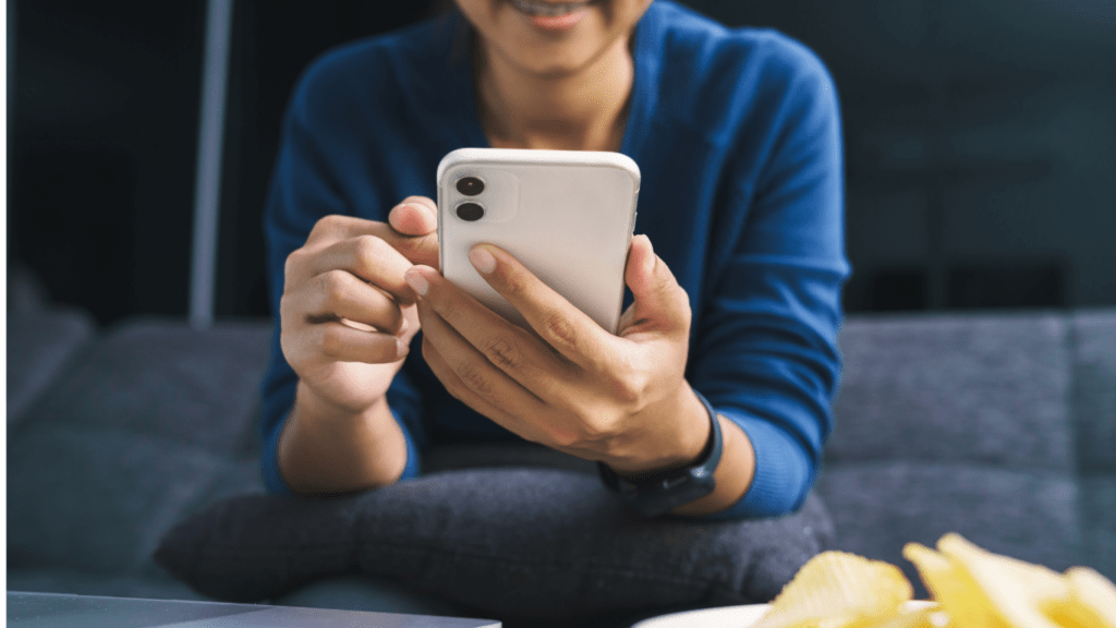 woman using cellphone to bet in sports  